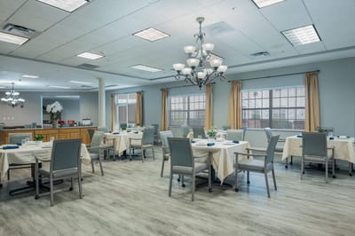Bright dining room with tables set for meals