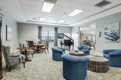 Comfortable common area with seating and a piano