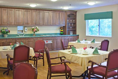 Well-set dining room with tables and floral decor