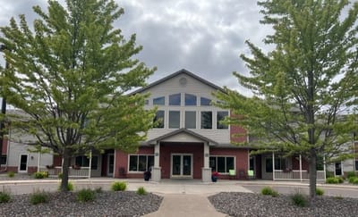 Exterior view of Viewcrest Health Center with landscaped trees