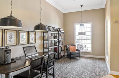 Cozy reading area with bookshelves and a work desk