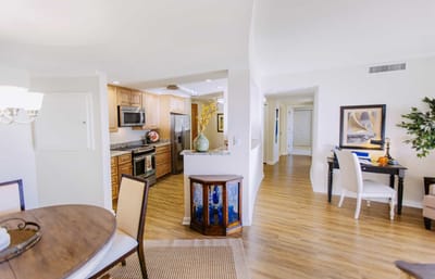 Bright interior of a resident unit with kitchen and dining area