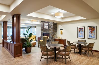 A cozy common area with seating and a fireplace
