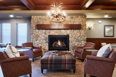 Cozy lounge area with comfortable seating and a fireplace