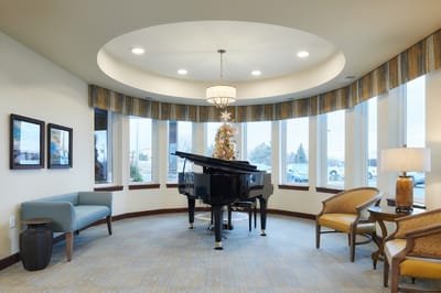 Interior view of a common area with a grand piano