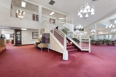Interior view of a spacious common area with stairs
