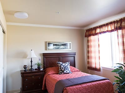 Cozy single resident room with a bed and decor