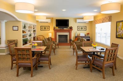 Common area with seating and decor in a senior living facility