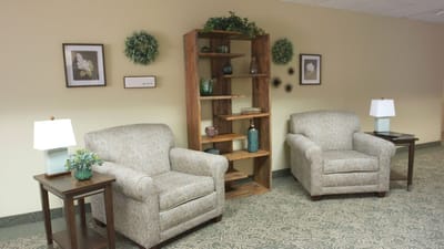 A cozy lounge area with seating and decor