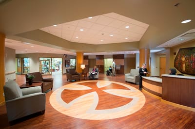 Interior view of a welcoming lobby with residents and staff