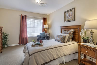 Cozy resident room with bed and seating