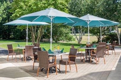 Outdoor dining area with umbrellas and chairs
