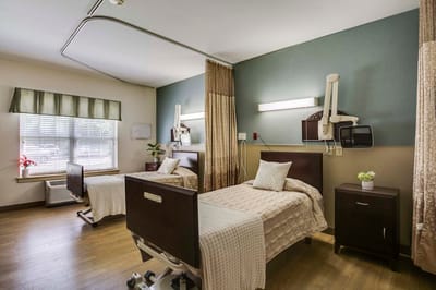 Shared resident room with two beds and window