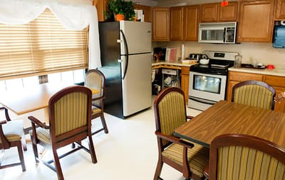 Interior view of a facility kitchen with dining area