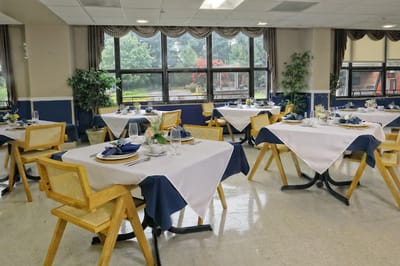Bright dining room with elegantly set tables