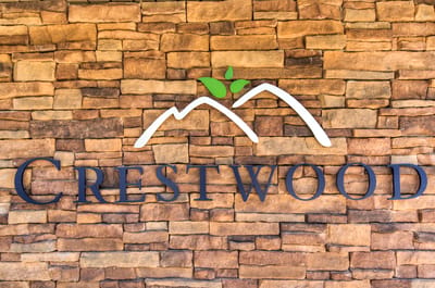 Facility logo displayed on a stone wall