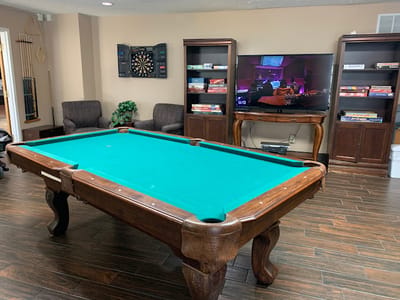 Activity room with a pool table and games
