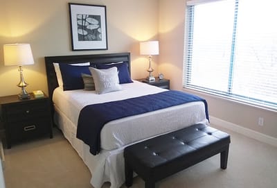 Cozy resident room with bed and natural light