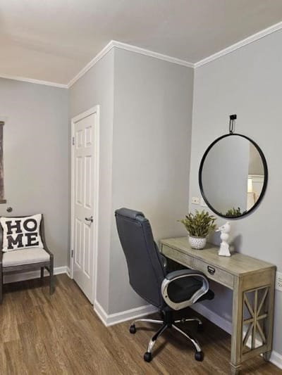 A cozy corner with a desk and decorative elements