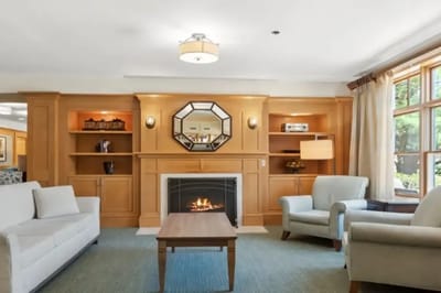 Cozy common area with a fireplace and seating