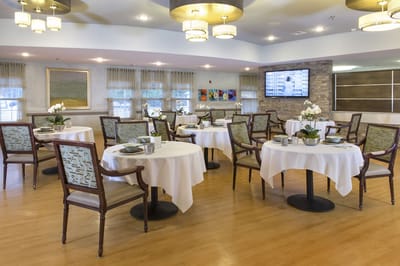 Dining room setup with elegant tables and decor