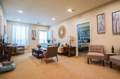 Cozy interior of a resident's room with seating
