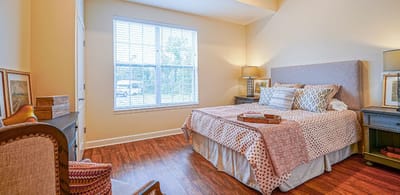 Brightly lit bedroom with a cozy setup