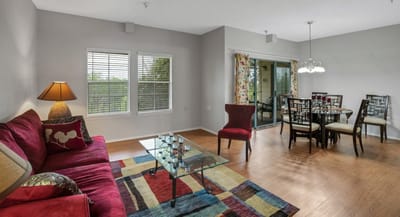 Bright and modern common area with dining setup