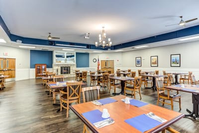 Bright dining room with wooden tables and chairs
