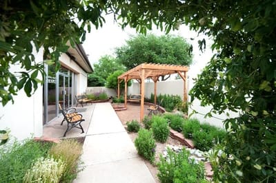 Garden area with wooden pergola and seating