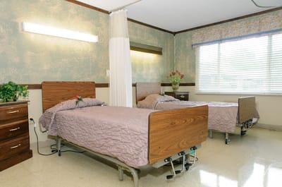 Two beds in a shared resident room
