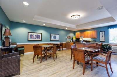 Common area with dining tables and coffee station