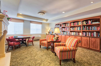 Interior common area with seating and bookshelves