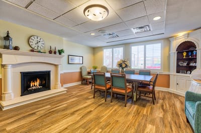 Common area with a dining table and fireplace