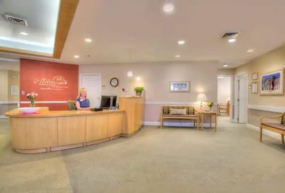 Reception area with staff member at the desk
