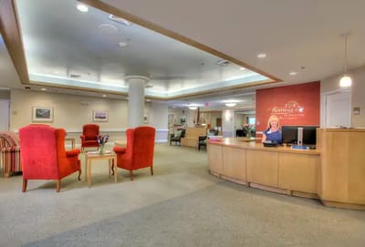 Interior view of the reception area with a staff member