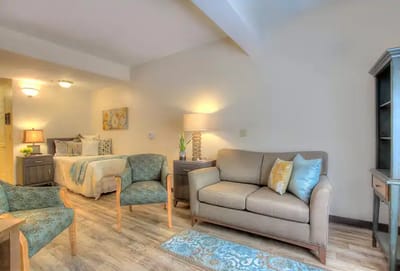 Cozy private resident room with furniture and decor