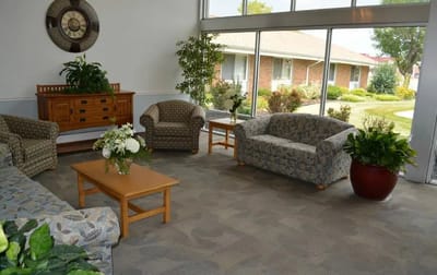 Bright common area with seating and plants