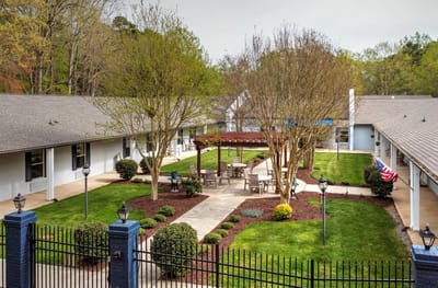 Serene outdoor courtyard with seating and greenery