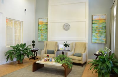 Bright interior common area with seating and plants
