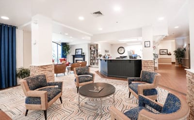 Bright common area in a senior living facility with seating