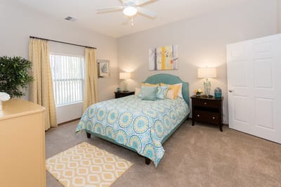 Brightly decorated private resident room with cozy furnishings