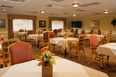Dining area with tables and flower centerpieces