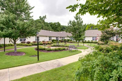 Well-maintained courtyard with walking paths and greenery