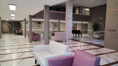 Interior common area with seating and a piano