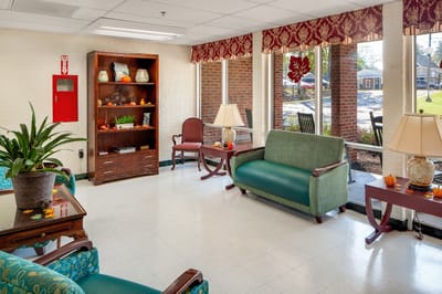 Bright common area with seating and plants