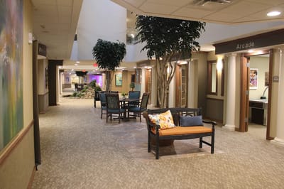 Bright common area with seating and decorative plants