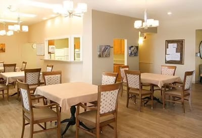 Bright dining area with tables and chairs