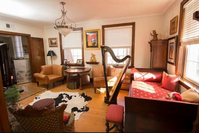 Cozy common area with a harp and seating
