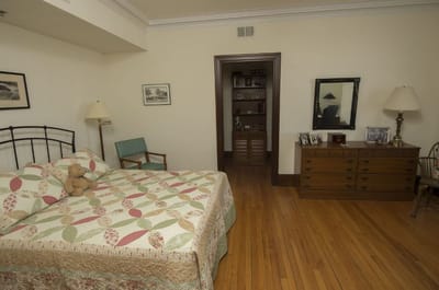 Cozy bedroom with a bed and wooden furniture
